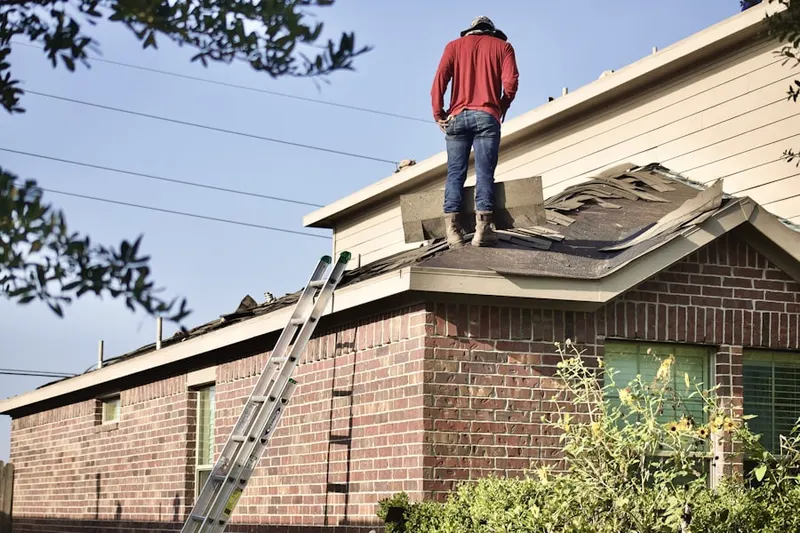 Professional roofer working on a residential roof in San Gorgonio